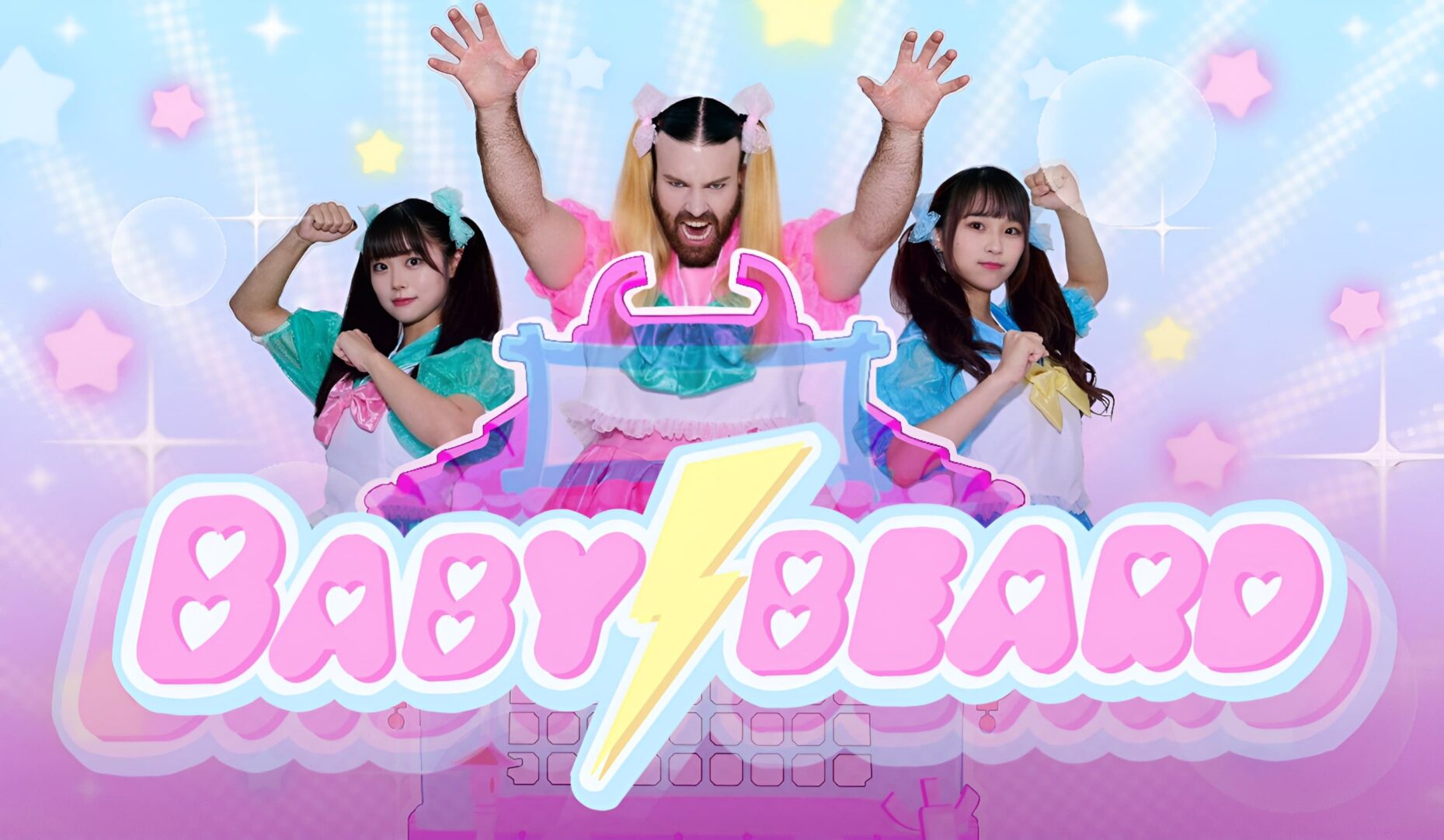 BABYBEARD band members in colorful, anime-inspired outfits striking dynamic poses against a pastel background with stars, promoting their "Twisted Kaiju Tale" VR music video.